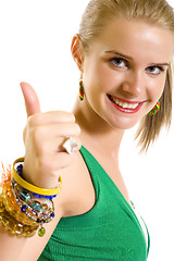 Image showing Casual woman smiling with her thumbs up