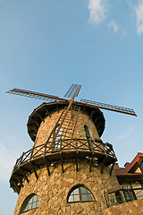 Image showing stylized windmill at blue sky