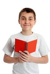 Image showing Student holding book in both hands