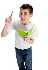 Image showing Happy studet with pen and book
