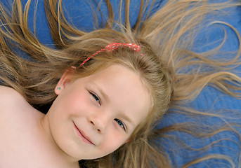 Image showing Little girl sunbathing