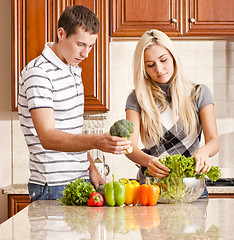 Image showing Young Couple Making Salad