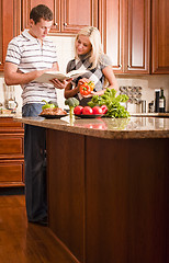 Image showing Young Couple Cooking