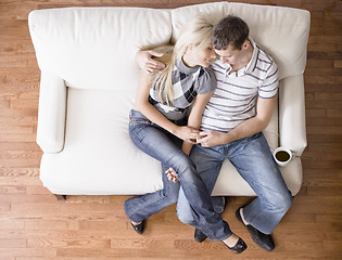 Image showing Young Couple Sitting on Love Seat