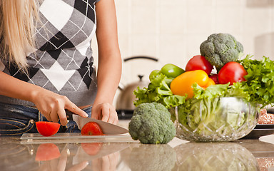 Image showing Woman Cutting Tomato