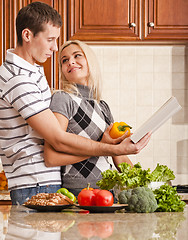 Image showing Young Couple Cooking