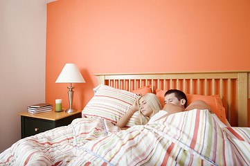 Image showing Young Couple Sleeping in Bed