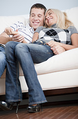 Image showing Affectionate Couple Laughing and Relaxing on Couch