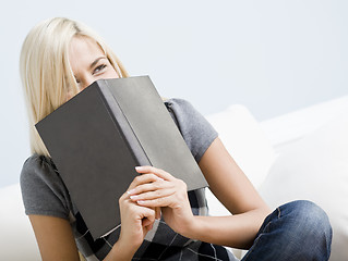 Image showing Laughing Woman Holding a Book