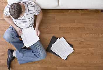 Image showing Young Man Doing Taxes