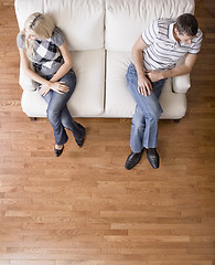 Image showing Young Couple Sitting on Love Seat