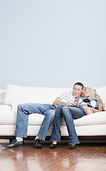 Image showing Affectionate Couple Laughing and Relaxing on Couch