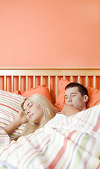 Image showing Young Couple Sleeping in Bed