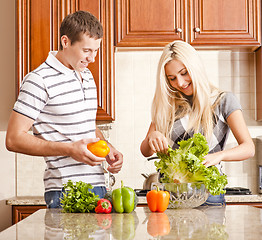 Image showing Young Couple Making Salad