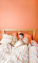 Image showing Young Couple Sleeping in Bed