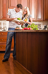 Image showing Young Couple Cooking