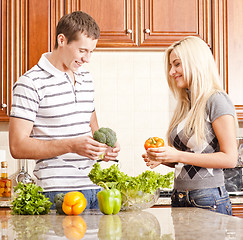 Image showing Young Couple Making Salad