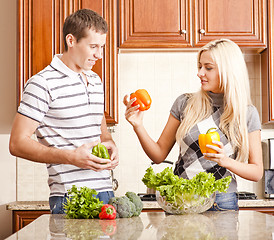 Image showing Young Couple Making Salad