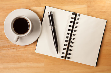 Image showing Blank Spiral Note Pad, Cup and Pen on Wood