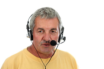 Image showing mature man in a business call center