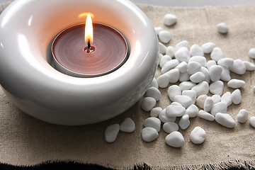 Image showing candles and massage stones in a calm zen spa