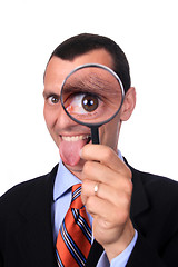 Image showing businessman with magnifying glass