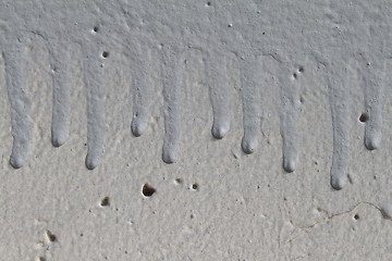 Image showing Trickles of paint on wall