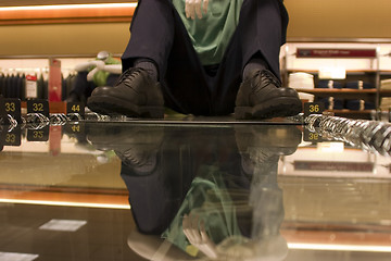 Image showing Mannequin sitting on the suits display