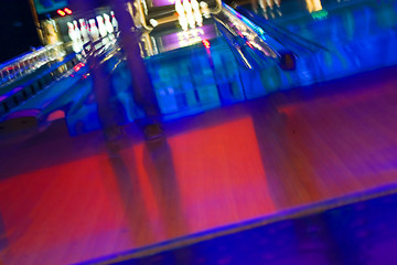 Image showing Abstract Blurry Bowling Alley with a girl standing