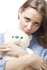 Image showing Sad woman with teddy bear 