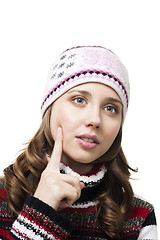 Image showing Face of a beautiful woman thinking in winter cap