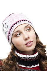 Image showing Woman in winter cap interested