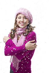 Image showing Woman smile while snowflakes fall