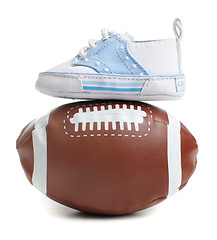 Image showing Football with baby shoes