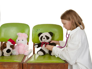 Image showing girl playing doctor with her toys