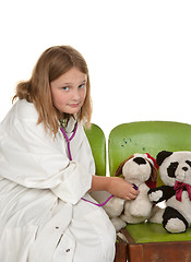 Image showing girl playing doctor with her toys