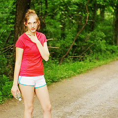 Image showing Woman In Red Running