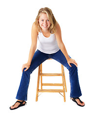 Image showing Casual Woman Sitting On A Small Ladder