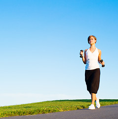 Image showing Young Woman Walking