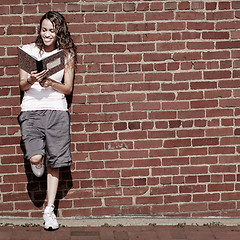 Image showing Brick Wall Notebook Girl