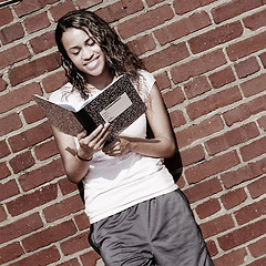 Image showing Brick Wall Notebook Girl