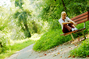 Image showing Girl on Forest Bench