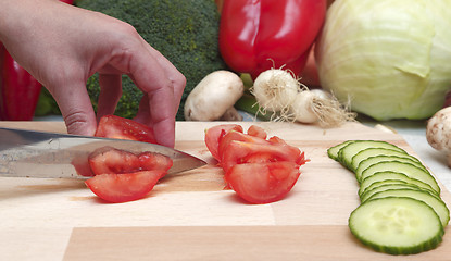 Image showing Hand cutting vegetables