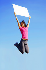 Image showing Jumping Girl With Sign