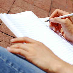 Image showing Girl Writing In Note Book