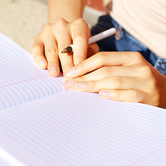 Image showing Girl Writing In Note Book