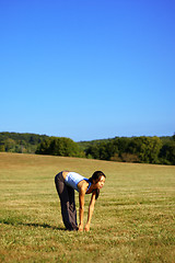 Image showing Girl Practicing Yoga In Field