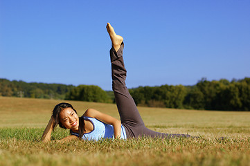 Image showing Girl Practicing Yoga In Field