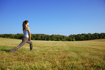 Image showing Girl Practicing Yoga In Field