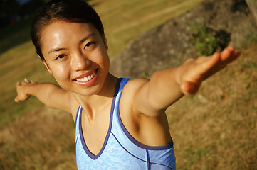 Image showing Girl Practicing Yoga In Field